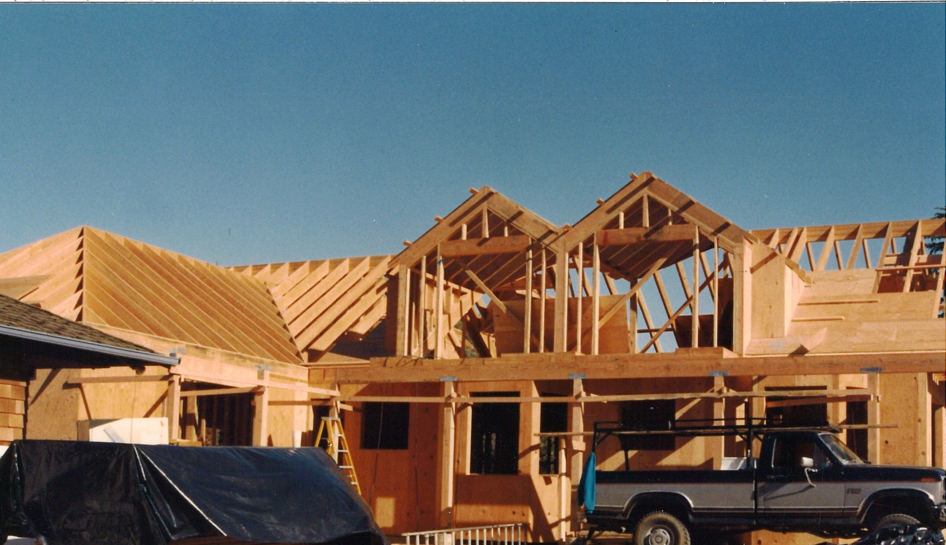 Rivoir family construction site at Hill Avenue, Saratoga — new home roof framing by the Rivoir family real estate company